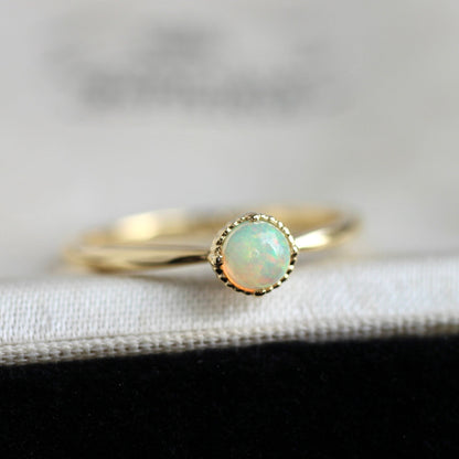 オパール 0.17ct K18YG ミルフレーム×絞りアーム リング 【MJ2402】