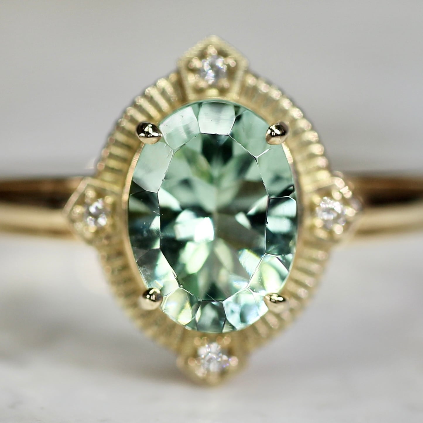 ミントブルートルマリン 1.16ct ダイヤモンド 0.02ct K10YG コンケーブカット トゥルース×グルーヴアーム