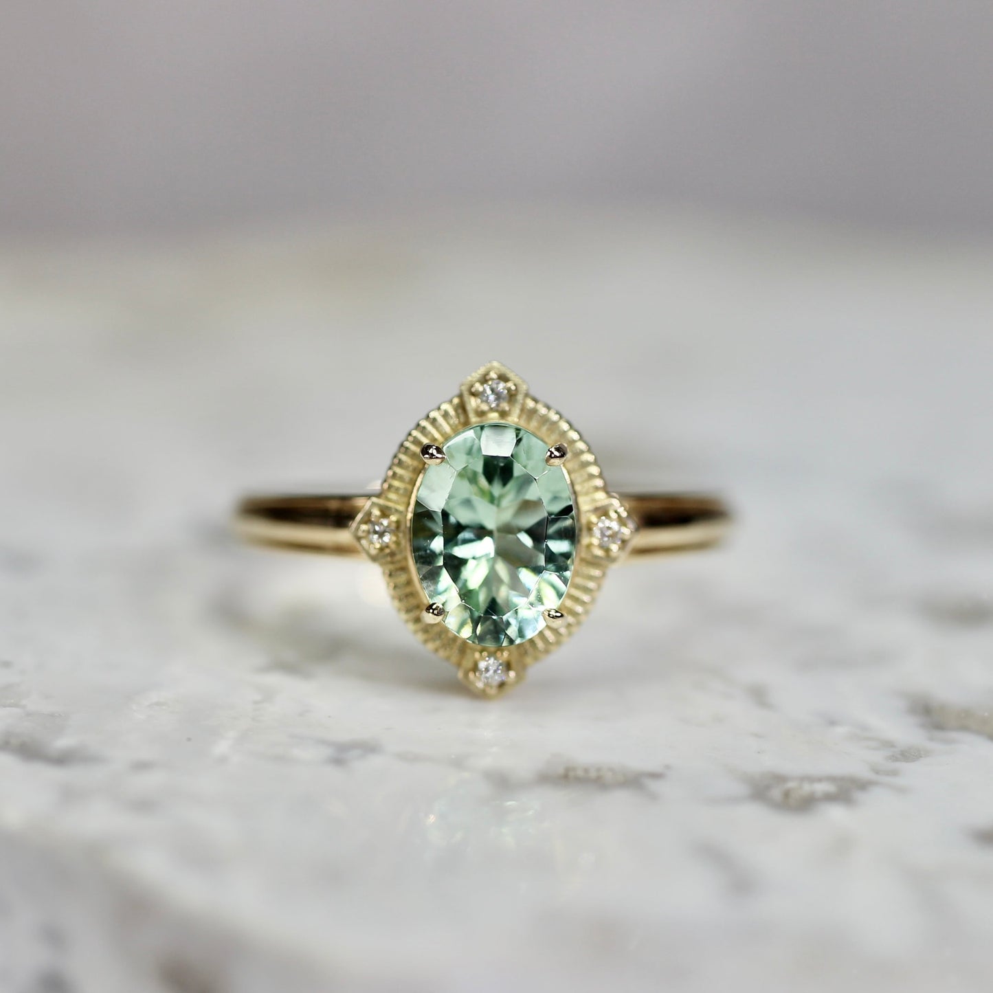 ミントブルートルマリン 1.16ct ダイヤモンド 0.02ct K10YG コンケーブカット トゥルース×グルーヴアーム