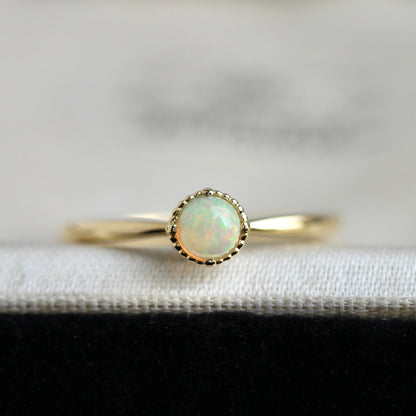 オパール 0.17ct K18YG ミルフレーム×絞りアーム リング 【MJ2402】